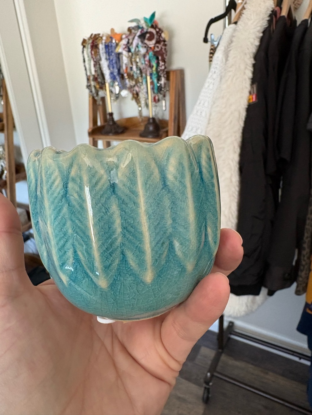light blue ceramic feather votive holder